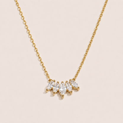 Gold pendant necklace with five marquise-cut white zirconia stones fanned along a fine chain — Folie à Trois Facet NECKLACE