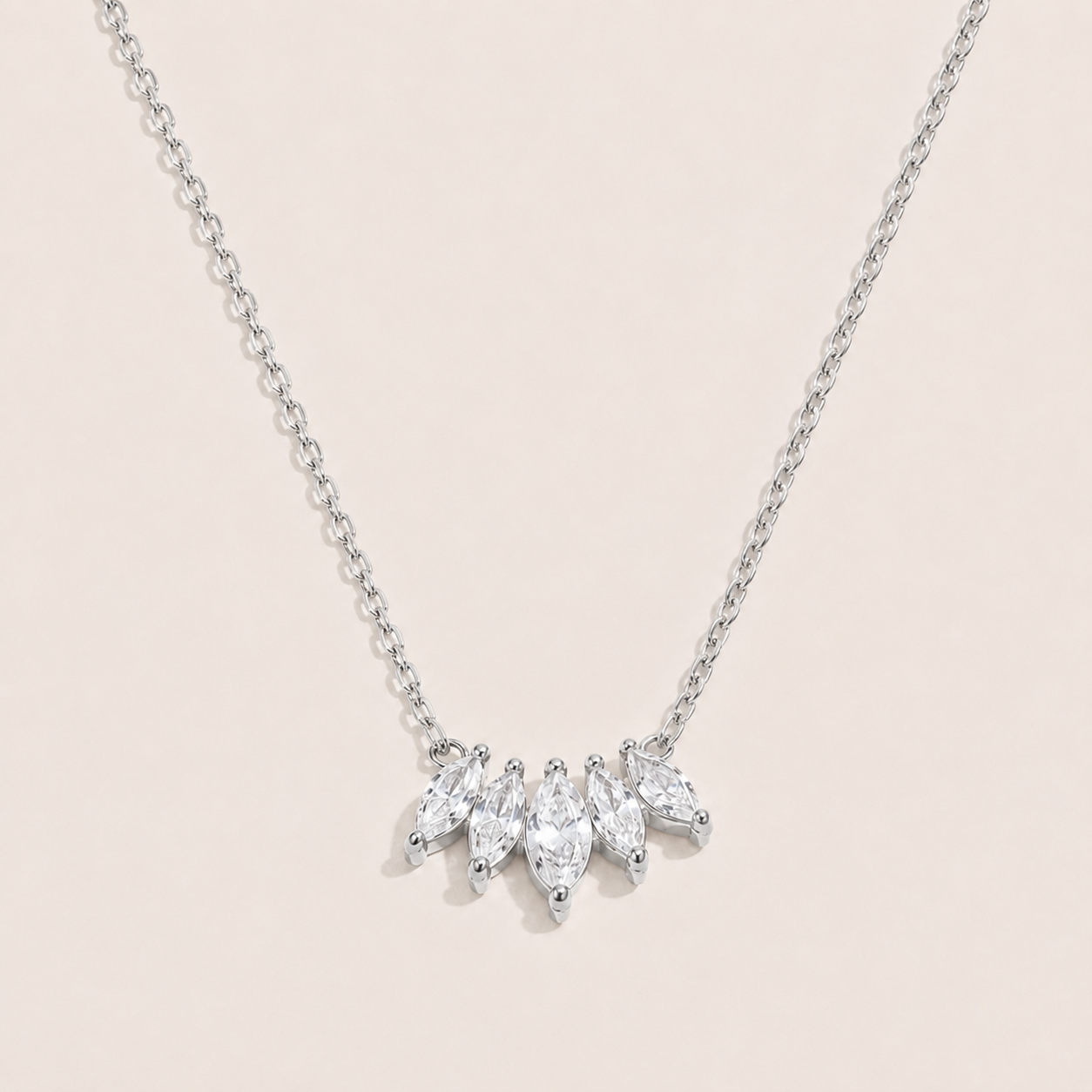 Silver pendant necklace with five marquise-cut white zirconia stones fanned along a fine chain — Folie à Trois Facet NECKLACE
