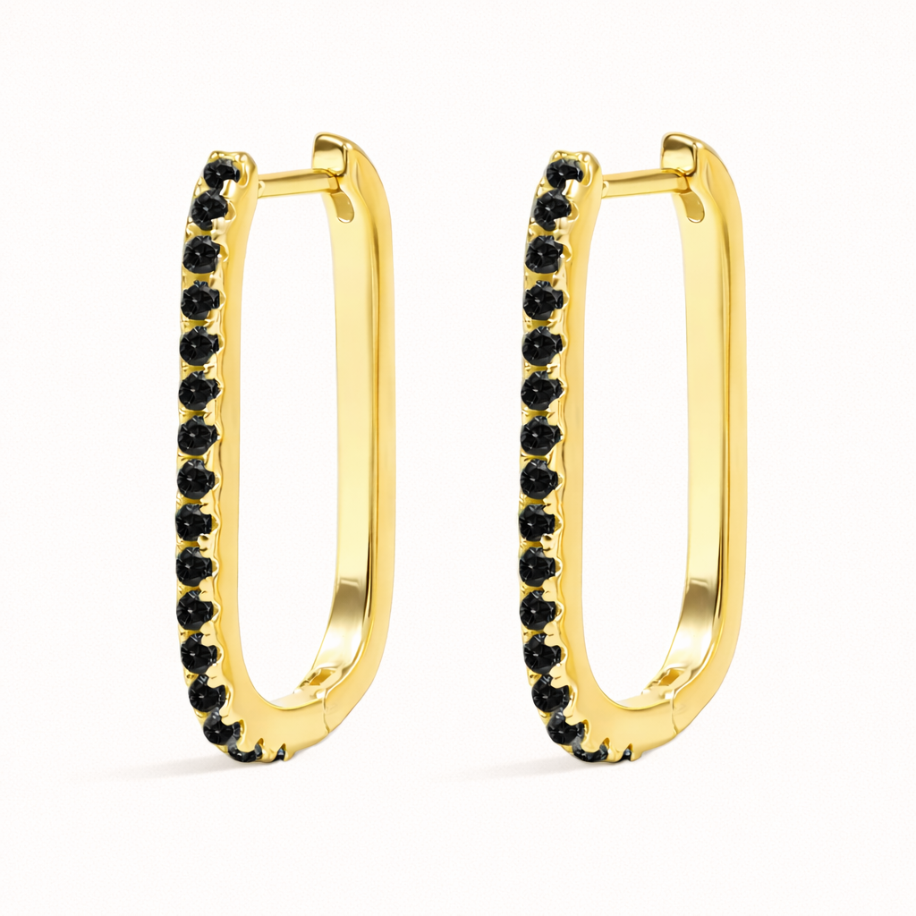 In this colorway, Fair Game Earrings pair a gold oblong hoop with a striking row of jet-black pave stones along one side.