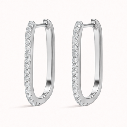 Rendered in silver tone, Fair Game Earrings keep their signature oblong hoop shape with a row of clear pave crystals.