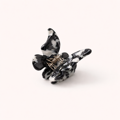 Black and white cow-print acetate butterfly-shaped claw clip from the Falling For You Butterfly HAIR CLIP collection.