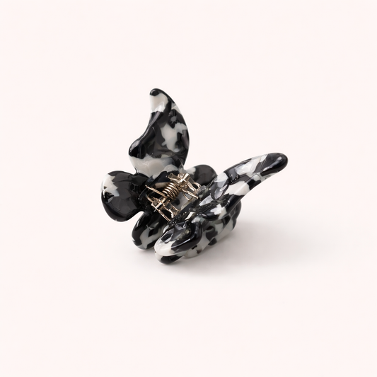 Black and white cow-print acetate butterfly-shaped claw clip from the Falling For You Butterfly HAIR CLIP collection.