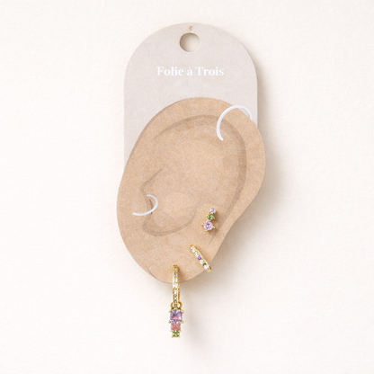 Displayed on a Folie a Trois ear card, Fashion House SET shows its pastel stones arranged for a curated ear look.