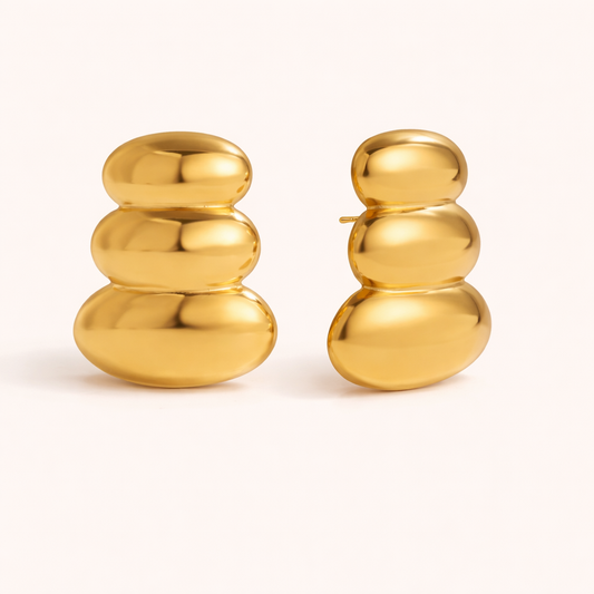 The Femme Fatale EARRINGS are chunky gold huggie hoops stacked in three rounded bubble sections in a row.
