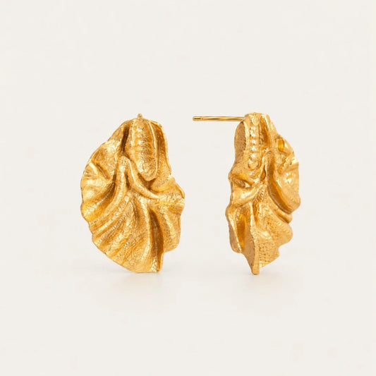 Gold Feuille EARRINGS: textured, ruffled leaf-shaped statement studs on a cream background — Folie à Trois wholesale