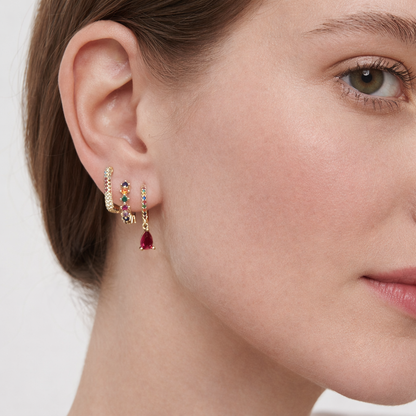 Worn along the ear, the Fia SET mixes multicolor gemstone hoops with a dangling pear-cut ruby drop charm.