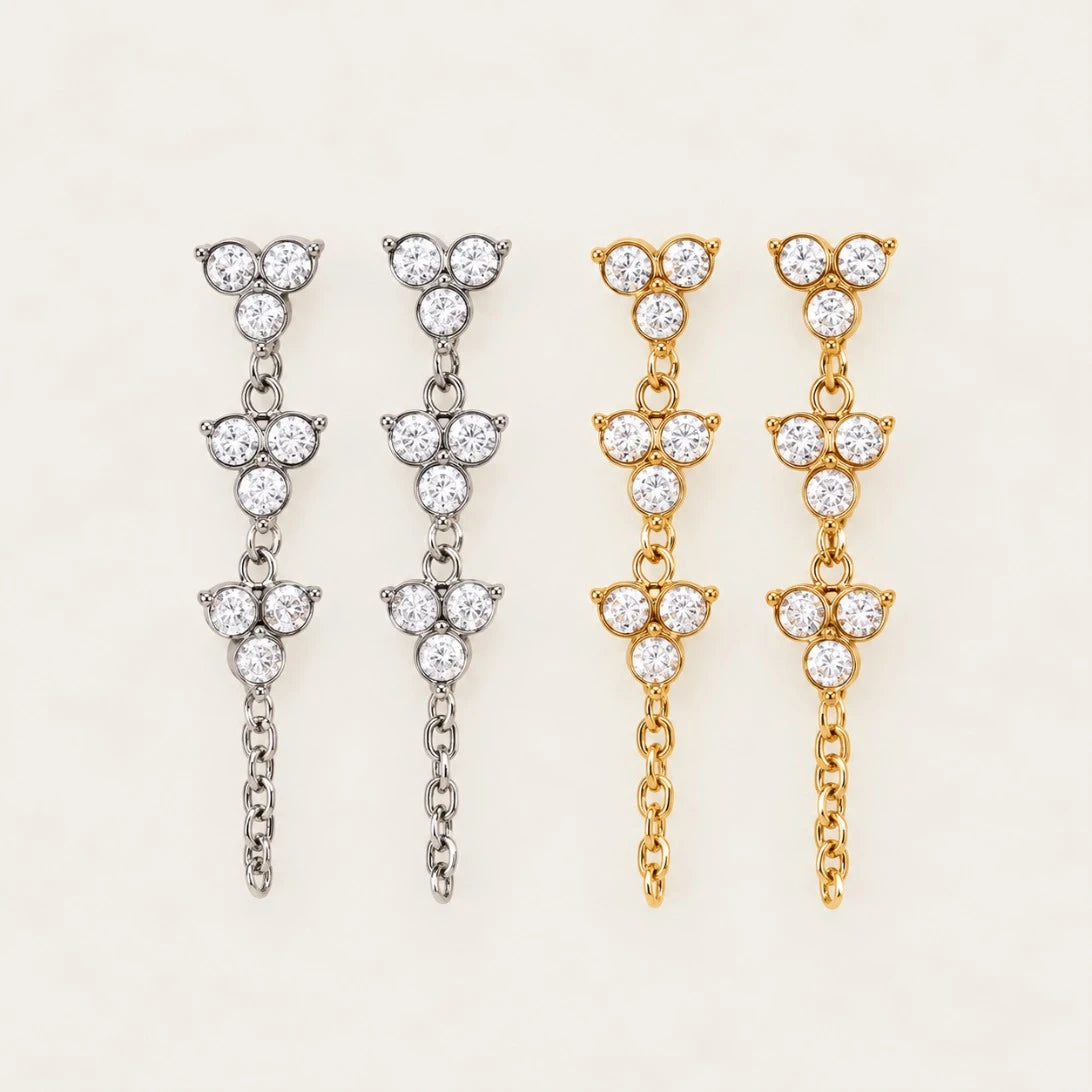 Fiore EARRINGS in silver-tone and gold side by side, zirconia trefoil drops with a fine chain — Folie à Trois wholesale