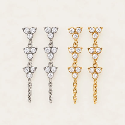 Fiore EARRINGS in silver-tone and gold side by side, zirconia trefoil drops with a fine chain — Folie à Trois wholesale