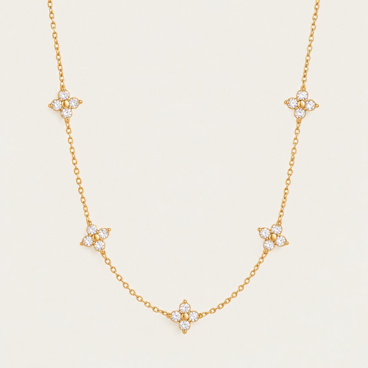Gold Fiore NECKLACE: delicate chain with five sparkling zirconia flower stations — Folie à Trois wholesale jewelry