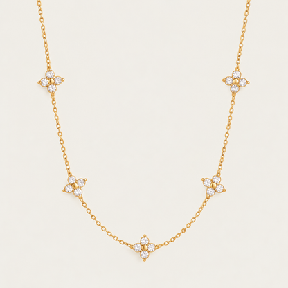 Gold Fiore NECKLACE: delicate chain with five sparkling zirconia flower stations — Folie à Trois wholesale jewelry