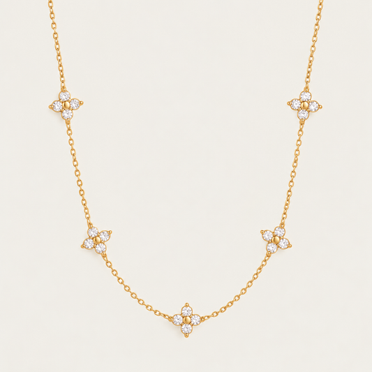 Gold Fiore NECKLACE: delicate chain with five sparkling zirconia flower stations — Folie à Trois wholesale jewelry