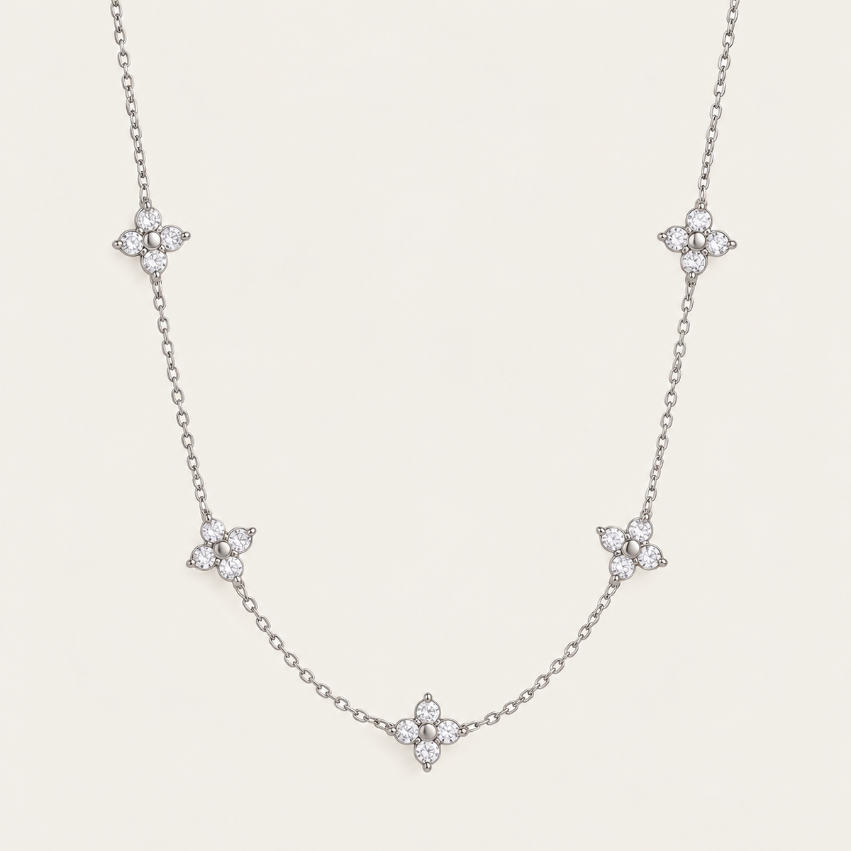 Silver-tone Fiore NECKLACE: delicate chain with five sparkling zirconia flower stations — Folie à Trois wholesale