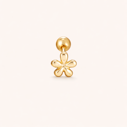 The Flower PIERCING is a gold labret stud topped with a small polished five-petal flower charm design.