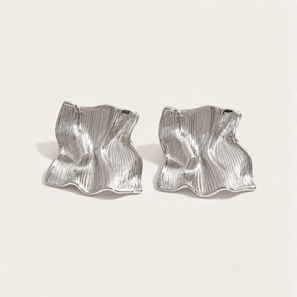 Silver-tone Froissé EARRINGS: a pair of chunky square earrings with a softly crumpled, textured surface — Folie à Trois
