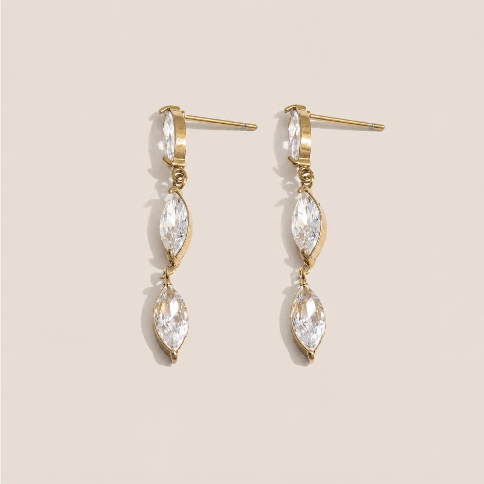 Gold drop earring with two marquise-cut white zirconia stones linked in a row — Folie à Trois Glint EARRINGS.