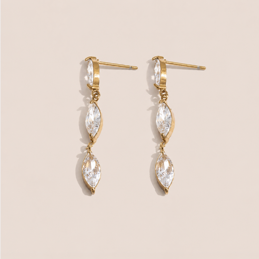 Gold drop earring with two marquise-cut white zirconia stones linked in a row — Folie à Trois Glint EARRINGS.