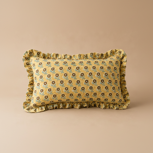 Golden Petal Rectangle cushion in mustard yellow patterned with small brown and teal sunflowers and a soft ruffled edge.