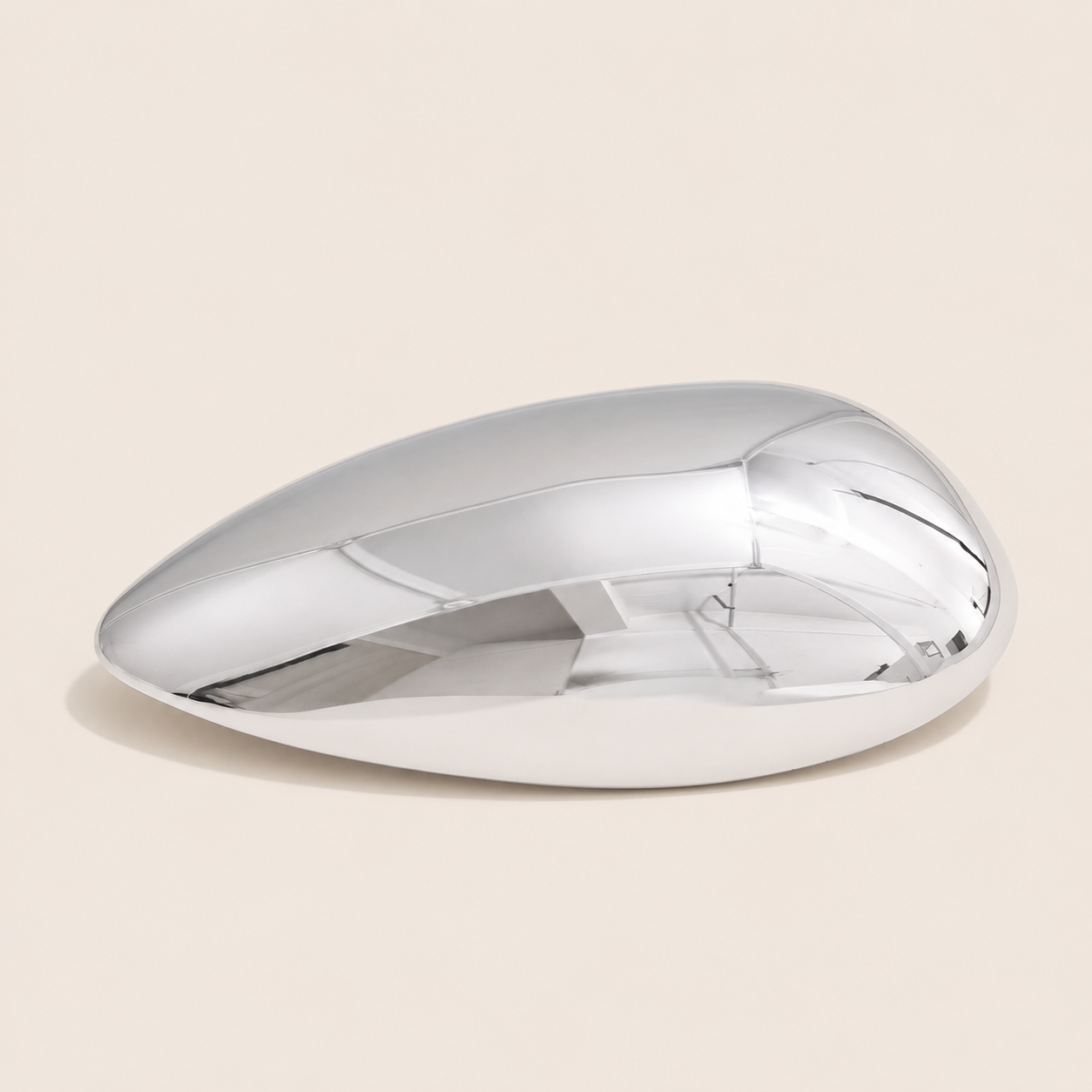 Silver teardrop-shaped sculptural brooch with a smooth domed surface on a cream backdrop — Folie à Trois Gota BROOCH