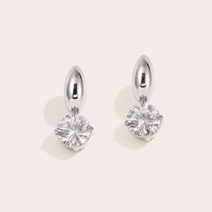 Silver stud earrings with a domed bean top and a round white zirconia drop on a cream backdrop — Folie à Trois Halcyon EARRINGS
