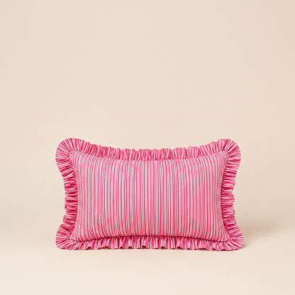 Close-up of the Harmony Pink Rectangle cushion's folded corner, showing pink linen, a red scalloped edge, and the Vive brand label.
