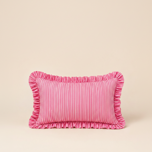 Close-up of the Harmony Pink Rectangle cushion's folded corner, showing pink linen, a red scalloped edge, and the Vive brand label.