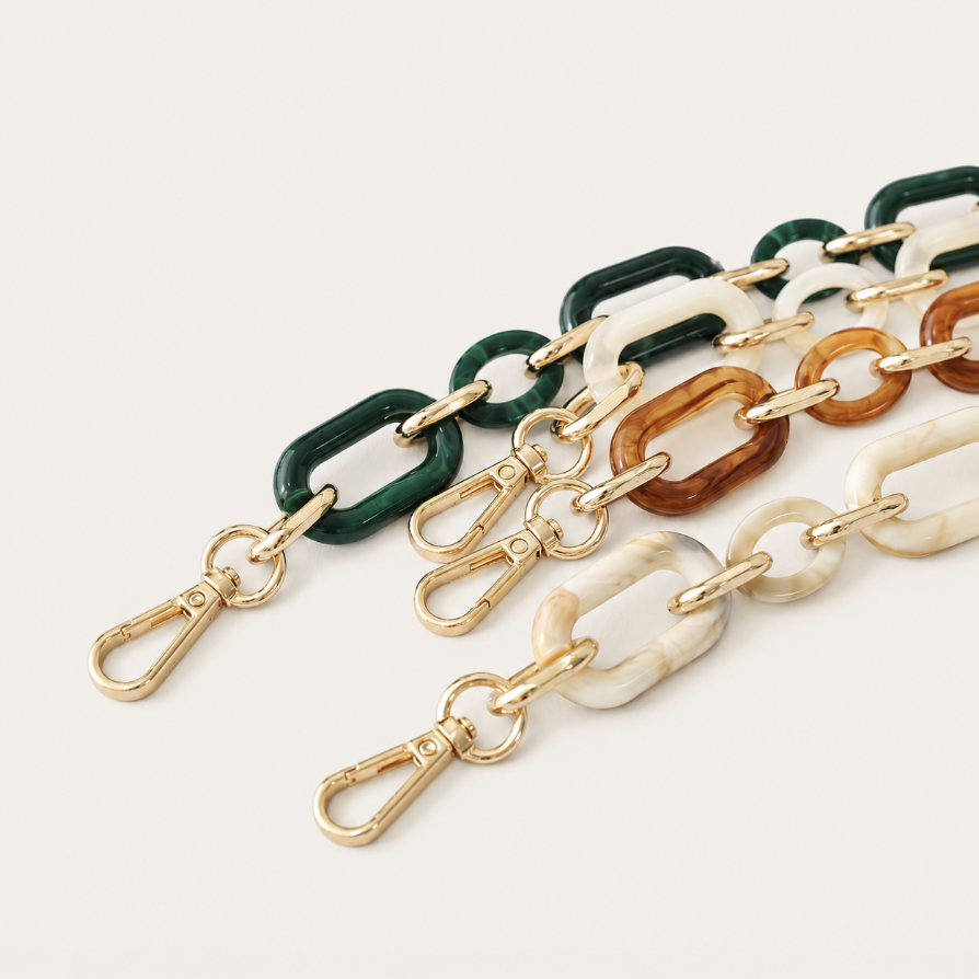 Hazel Long Phone Chain close-up, luxury packshot on beige background