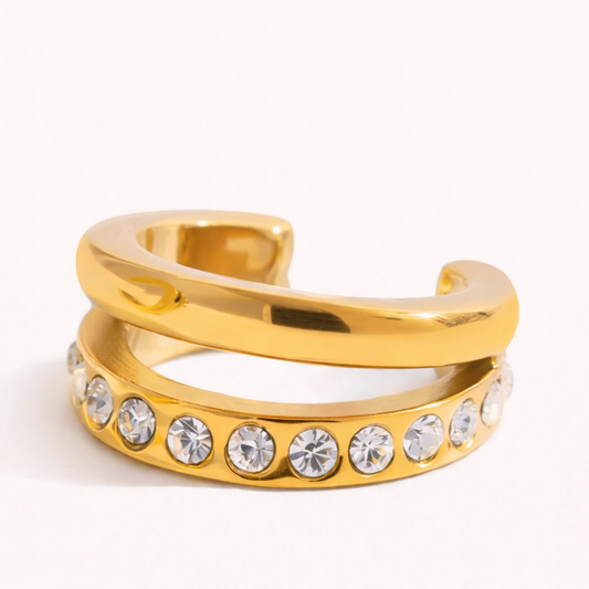 Hotline Ear Cuff featuring a sleek double-band design, one smooth polished row paired with a row of pave crystals, on a plain background.