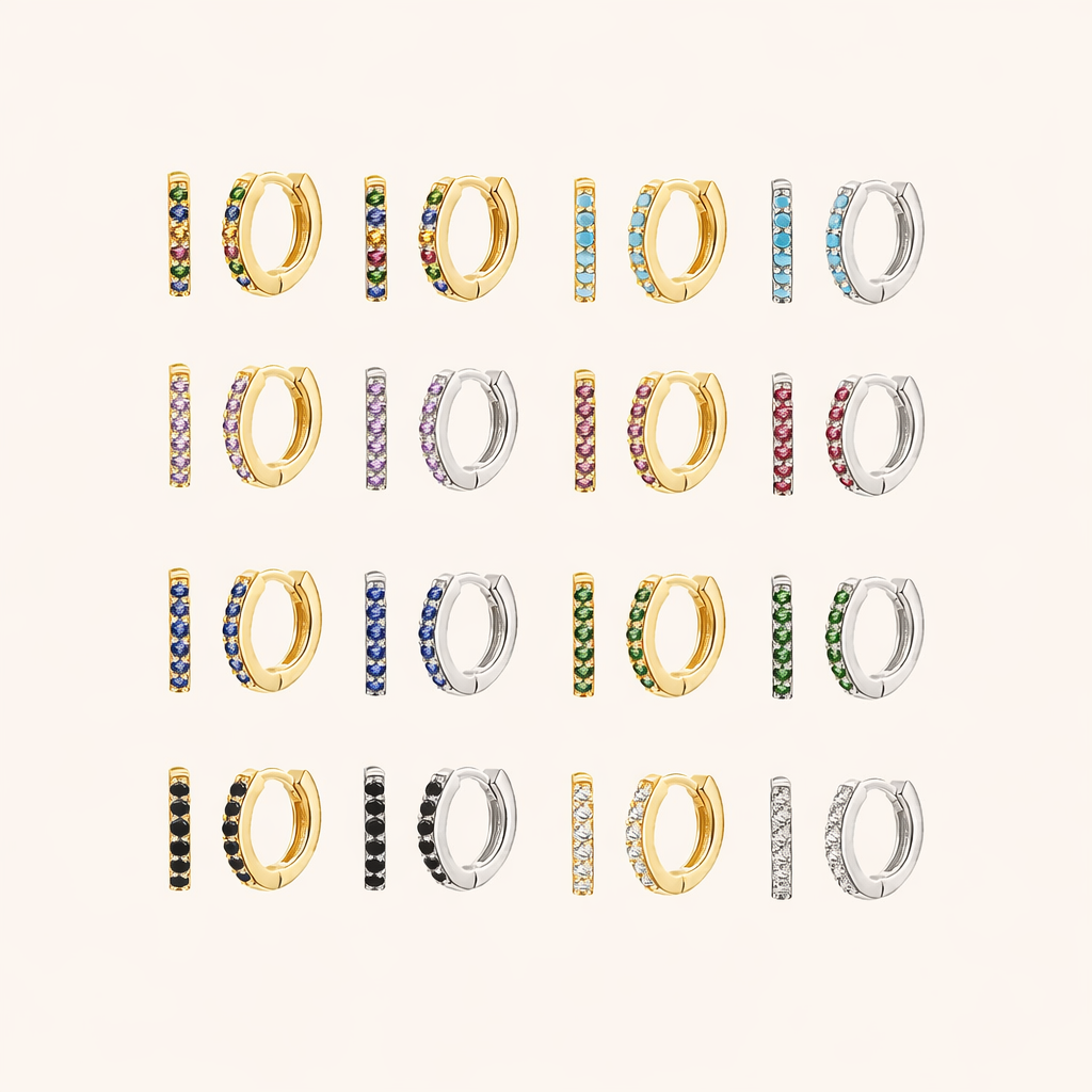 In a Dream Earrings shown in a full color grid, pave huggie hoops in gold and silver across many crystal shades.