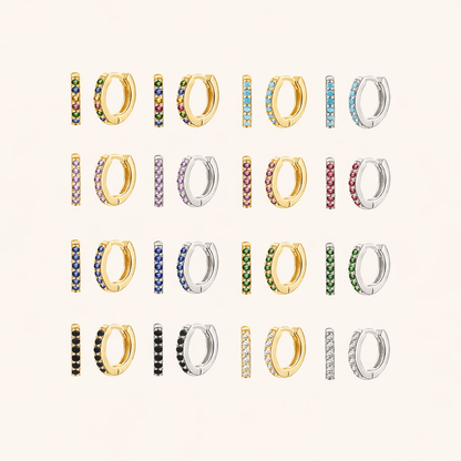In a Dream Earrings shown in a full color grid, pave huggie hoops in gold and silver across many crystal shades.