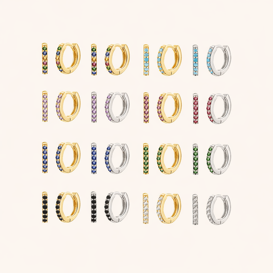 In a Dream Earrings shown in a full color grid, pave huggie hoops in gold and silver across many crystal shades.