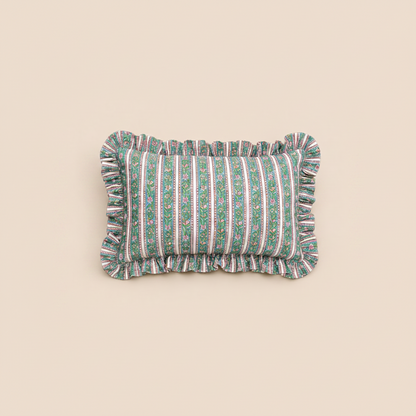 Indigo Mist Rectangle cushion in green vertical stripes with a delicate floral vine print and a ruffled trim on a warm cream background.