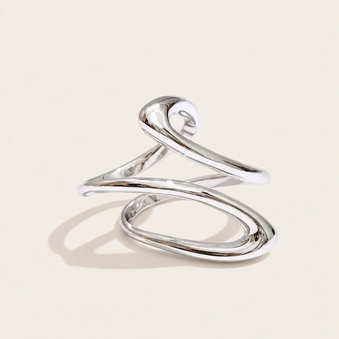 Silver-tone Infini RING: a slim open wire ring crossing over itself in a figure-eight spiral — Folie à Trois
