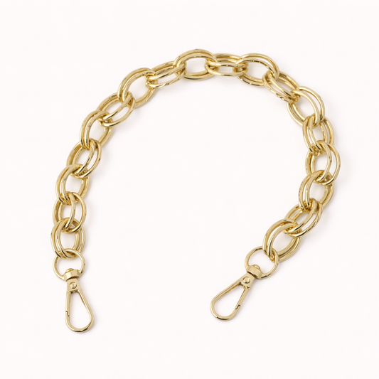 Gold-tone chunky chain-link Interlaced short phone strap coiled flat with two lobster clasps.