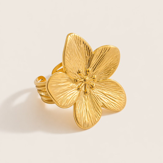 Gold statement ring shaped like a large textured five-petal flower with beaded stamens at its center — Folie à Trois Isle Of Paradise RING.