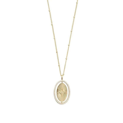 The Isyana NECKLACE in gold, an oval sunburst pendant with a small diamond star accent, shown on a plain white background.