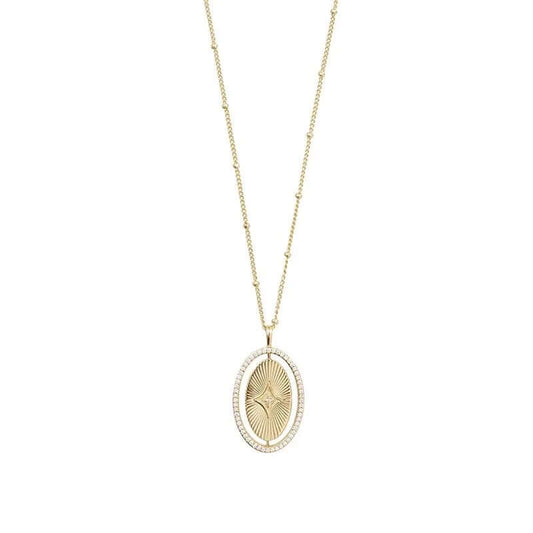 The Isyana NECKLACE in gold, an oval sunburst pendant with a small diamond star accent, shown on a plain white background.