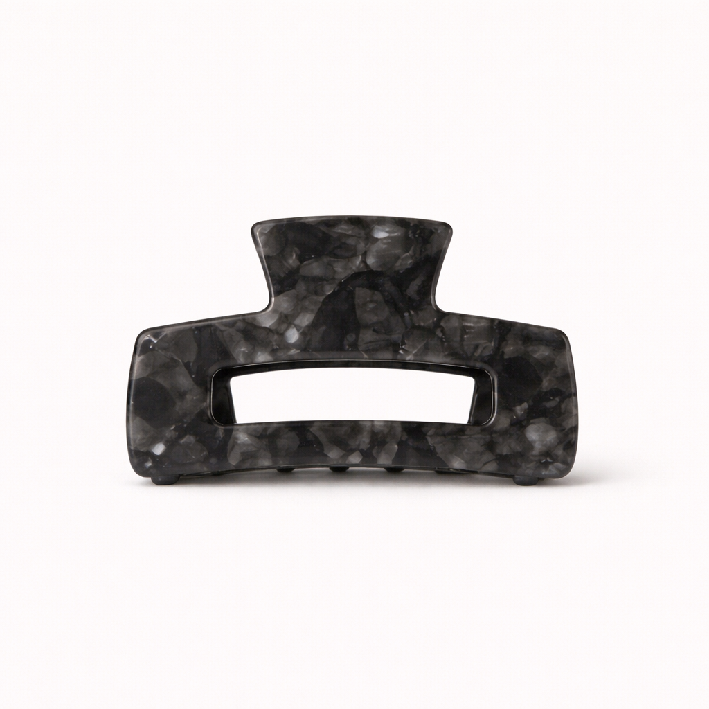 Charcoal grey marbled rectangular acetate claw clip with a cutout handle from the It Girl Big HAIR CLIP collection.