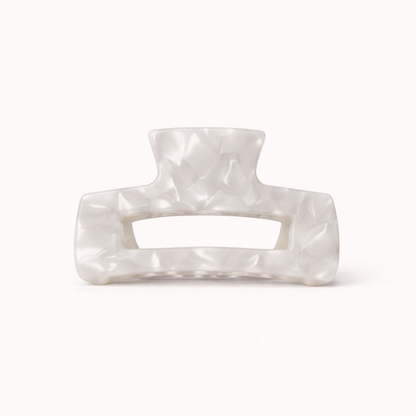 White pearl faceted rectangular acetate claw clip with a cutout handle from the It Girl Big HAIR CLIP collection.