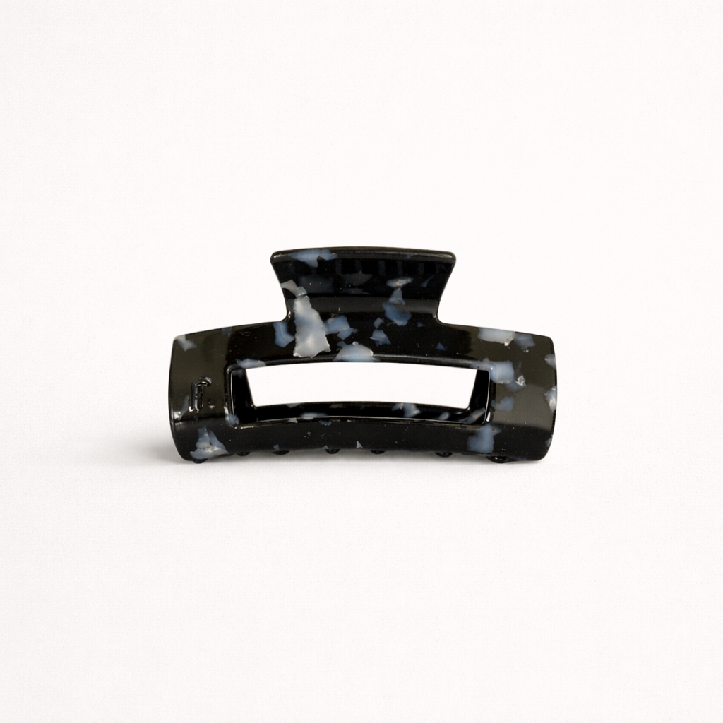 Black speckled marbled rectangular acetate claw clip with a cutout handle from the It Girl Medium HAIR CLIP collection.