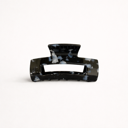 Black speckled marbled rectangular acetate claw clip with a cutout handle from the It Girl Medium HAIR CLIP collection.