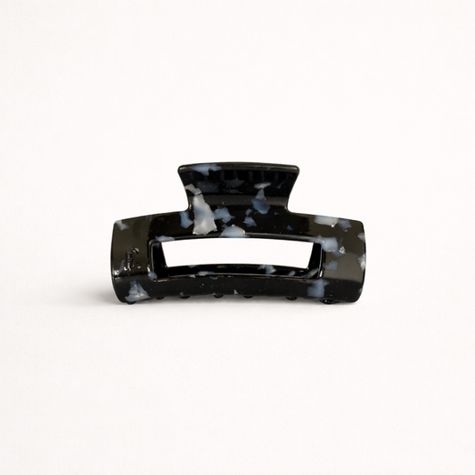 Black speckled marbled rectangular acetate claw clip with a cutout handle from the It Girl Medium HAIR CLIP collection.