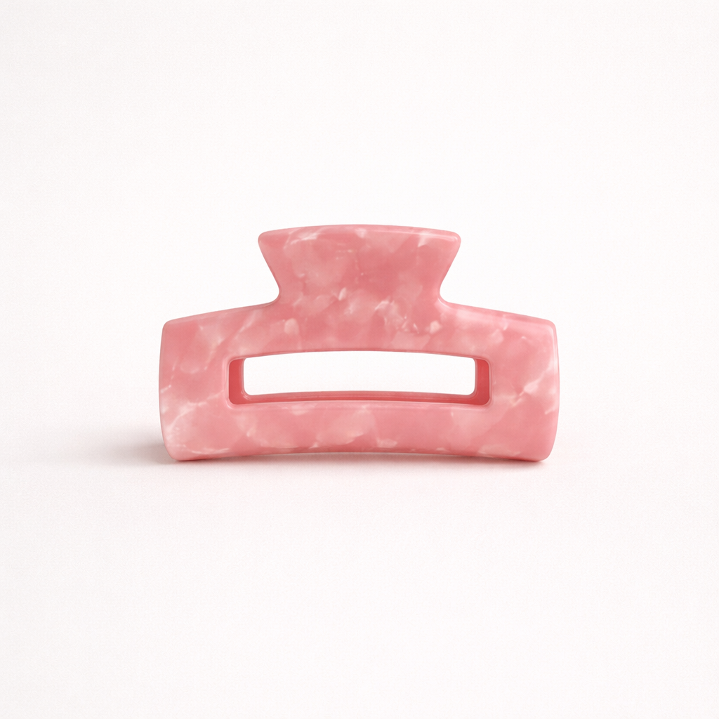 Pink marbled rectangular acetate claw clip with a cutout handle from the It Girl Medium HAIR CLIP collection.