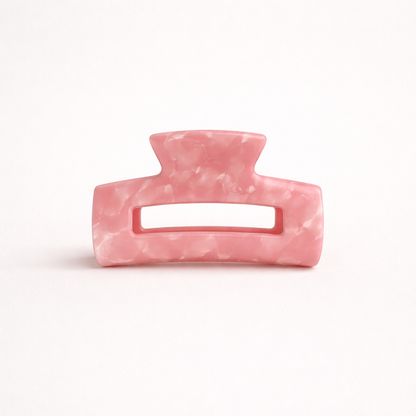 Pink marbled rectangular acetate claw clip with a cutout handle from the It Girl Medium HAIR CLIP collection.