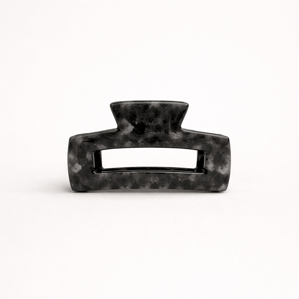 Charcoal grey marbled rectangular acetate claw clip with a cutout handle from the It Girl Medium HAIR CLIP collection.
