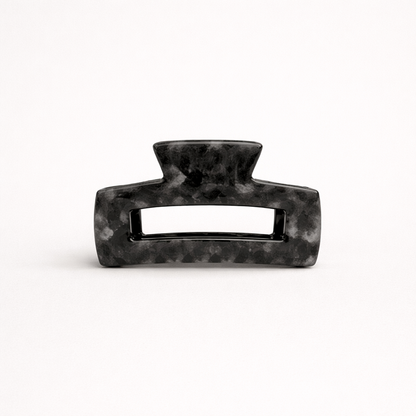 Charcoal grey marbled rectangular acetate claw clip with a cutout handle from the It Girl Medium HAIR CLIP collection.