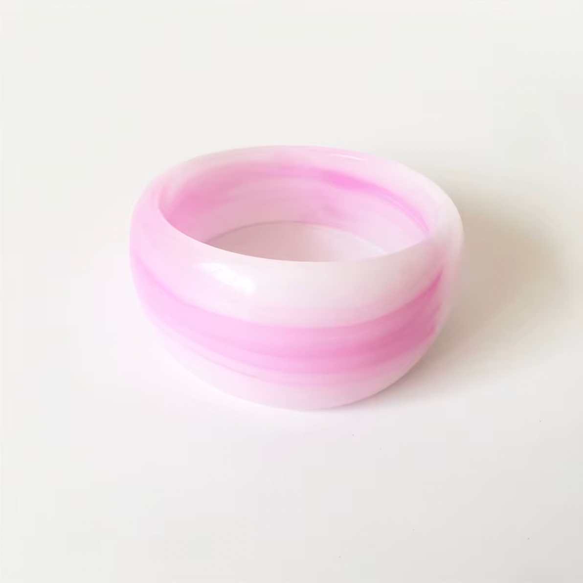 Ivana Acrylic BRACELET chunky bangle in a pink and white swirl acrylic, studio close-up on white.