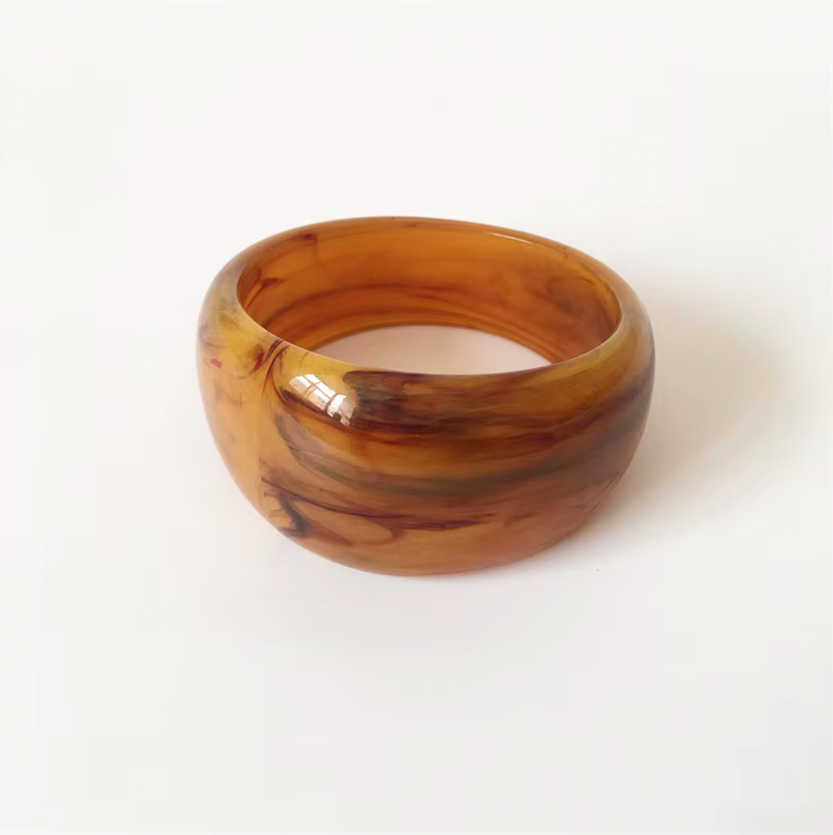 Ivana Acrylic BRACELET chunky bangle in a golden amber swirl acrylic, studio close-up on white.