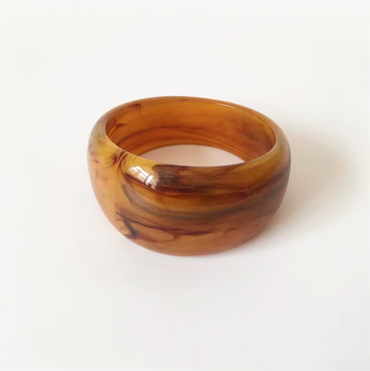 Ivana Acrylic BRACELET chunky bangle in a golden amber swirl acrylic, studio close-up on white.