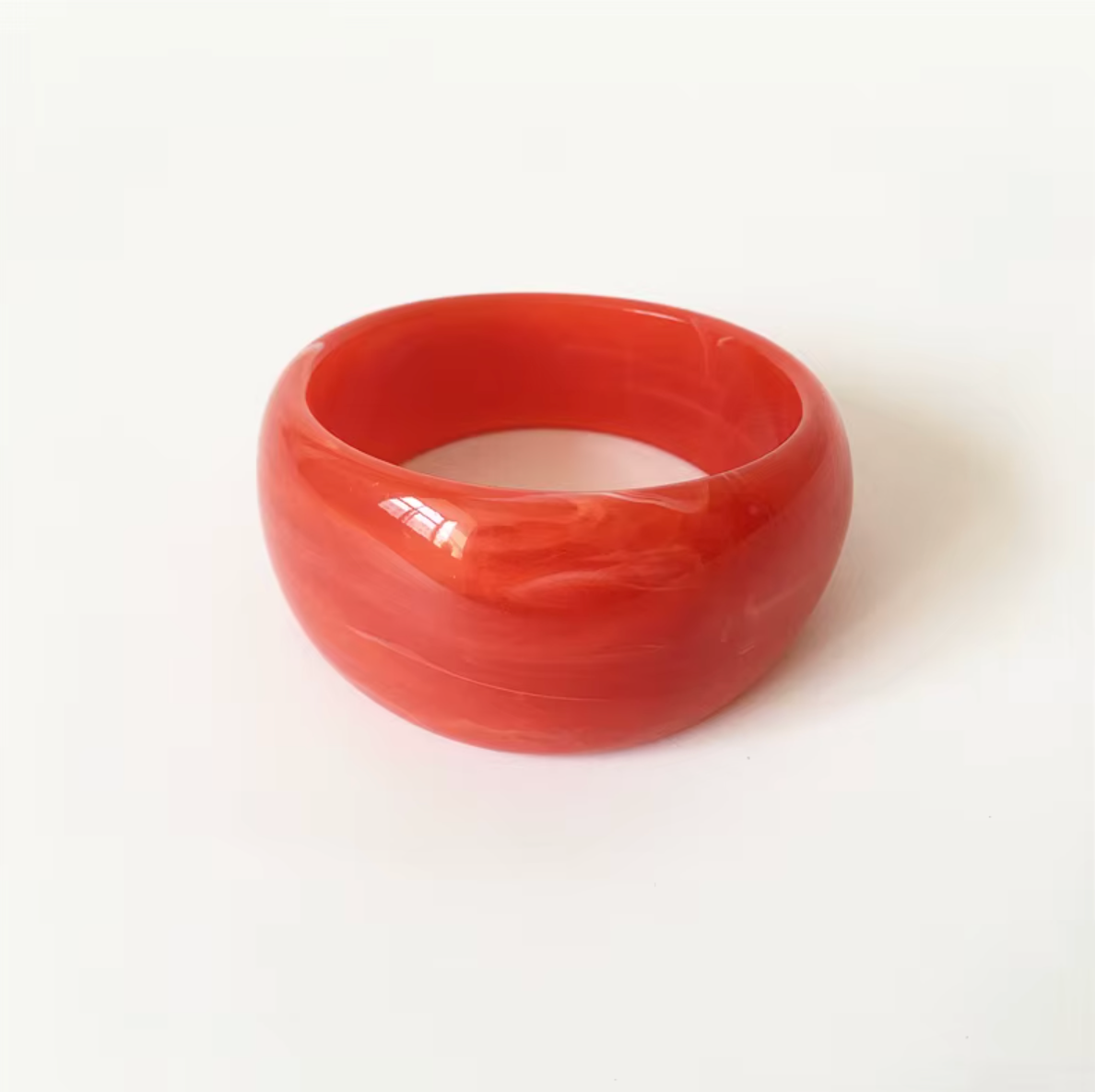 Ivana Acrylic BRACELET chunky bangle in a coral red swirl acrylic, studio close-up on white.