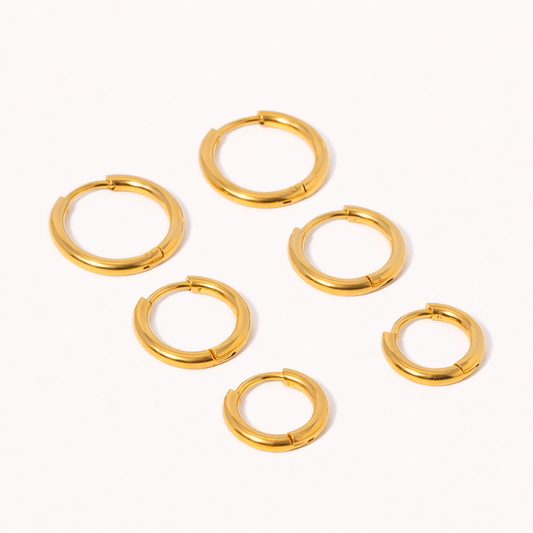 Keep The Base Earrings offer six polished gold huggie hoops in a range of sizes, from petite to medium.